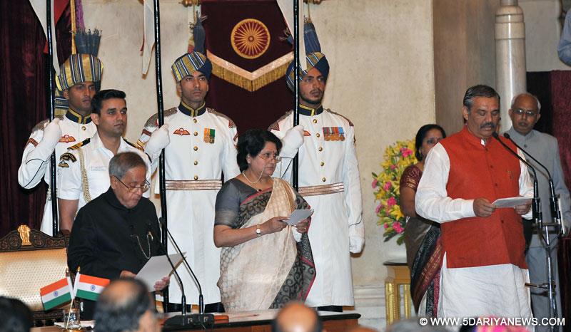 The President,  Pranab Mukherjee administering the oath as Minister of State to Vijay Sampla, at a Swearing-in Ceremony, at Rashtrapati Bhavan, in New Delhi on November 09, 2014. 