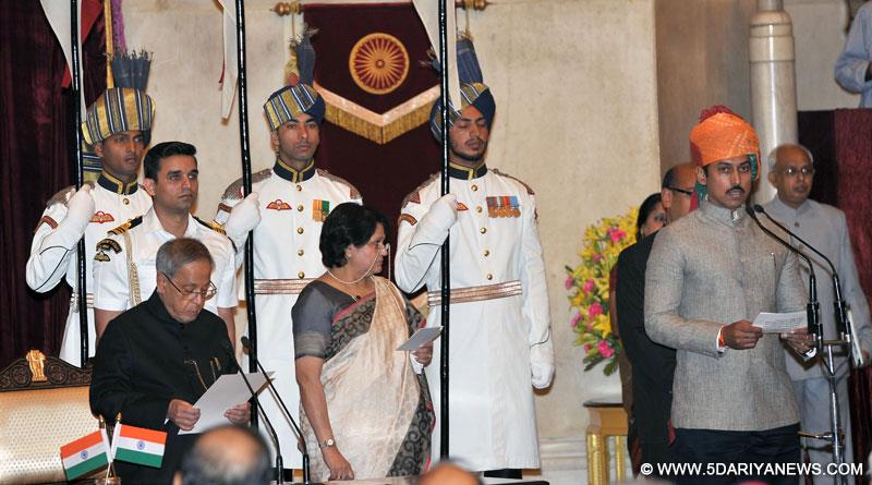 The President, Pranab Mukherjee administering the oath as Minister of State to Col. Rajyavardhan Singh Rathore, at a Swearing-in Ceremony, at Rashtrapati Bhavan, in New Delhi on November 09, 2014. 
