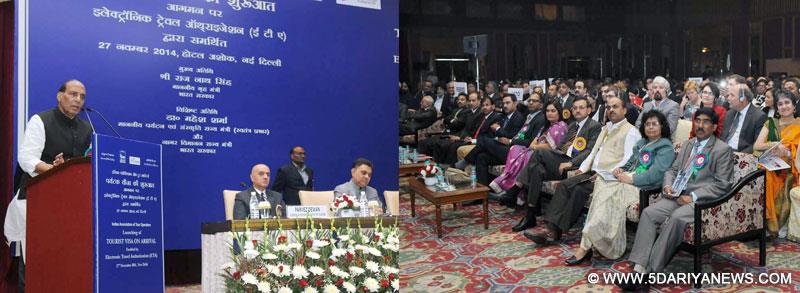 The Union Home Minister, Rajnath Singh addressing at the launch of the “Tourist Visa on Arrival enabled by Electronic Travel Authorization (ETA)”, in New Delhi on November 27, 2014. The Secretary, Ministry of Tourism, Dr. Lalit K. Panwar is also seen.