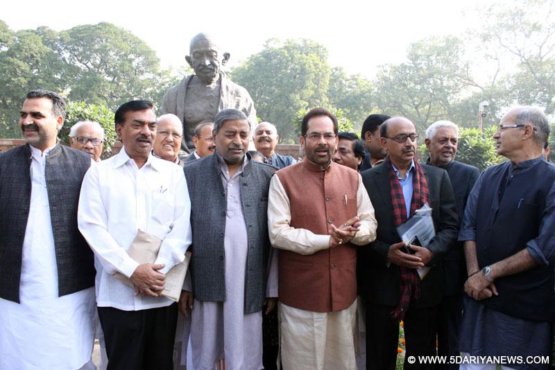  BJP MPs including Union MoS for Minority Affairs and Parliamentary Affairs Mukhtar Abbas Naqvi and Vijay Goel stage a demonstration at the Parliament premises in New Delhi, on Dec 5, 2014. 