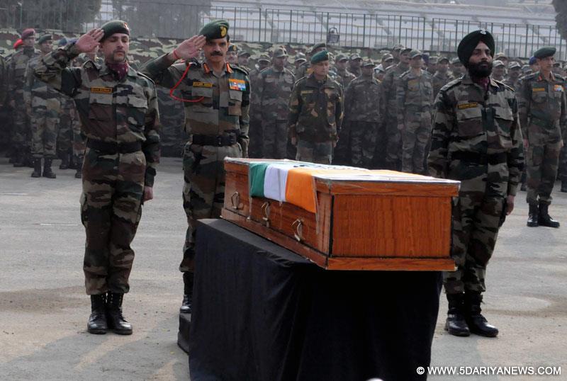 Chief of Army Staff, General Dalbir Singh pay tributes to the soldiers martyred on Friday`s attacks in Jammu and Kashmir at Muhara Uri Army camp, Badami Bagh Cantonment in Srinagar on Dec. 6, 2014.