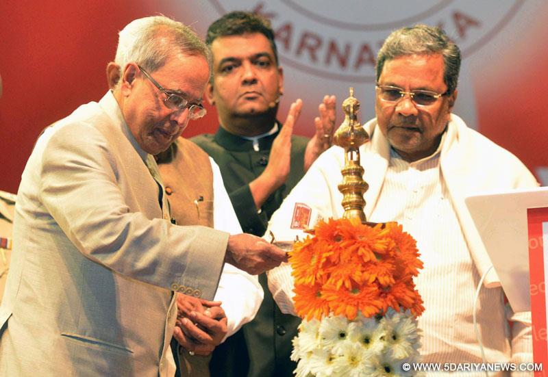 The President,  Pranab Mukherjee lighting the lamp at the launch of the ‘Mobile One’, a Mobile Governance application of Govt. of Karnataka, in Bangalore on December 8, 2014.