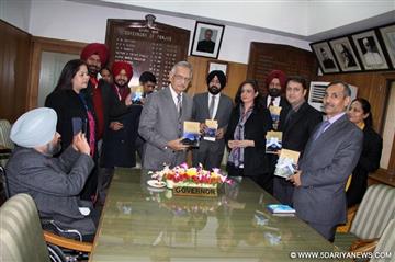 The Punjab Governor and Administrator, Union Territory, Chandigarh, Shivraj V. Patil releasing a book "KASAULI LIGHTS“ authored by Dimpy Ajrawat and Vinny Ajrawat at Punjab Raj Bhavan on 26.12.2014.