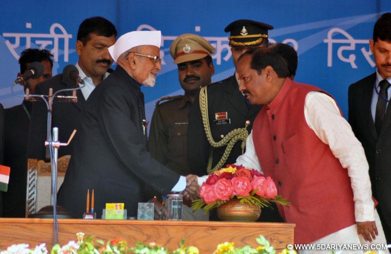 Jharkhand Governor Syed Ahmed administers oath of office to the new Chief Minister of Jharkhand Raghuwar Das at Morhabadi Grounds in Ranchi 