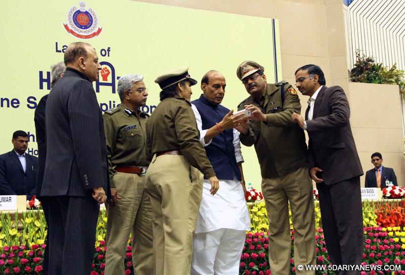 Rajnath Singh launching the women’s safety mobile application ‘Himmat’ of the Delhi Police, in New Delhi on January 01, 2015.