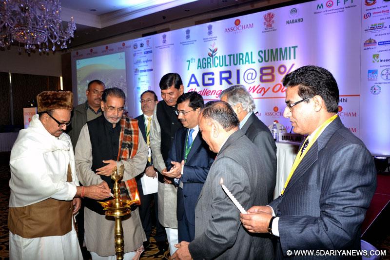 Radha Mohan Singh lighting the lamp at the 7th Agricultural Summit, in New Delhi on January 15, 2015. 