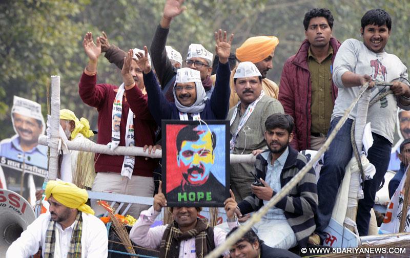 Aam Aadmi Party (AAP) leader Arvind Kejriwal during a roadshow ahead of filing his nominations papers for upcoming Delhi Assembly polls in New Delhi, on Jan 20, 2015. Also seen party leaders Manish Sisodia, Ashutosh and Sanjay Singh. 