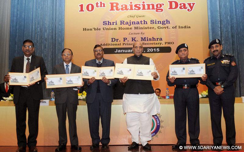 Rajnath Singh releasing a souvenir to mark the 10th Raising Day celebrations of the NDRF, in New Delhi on January 21, 2015. 