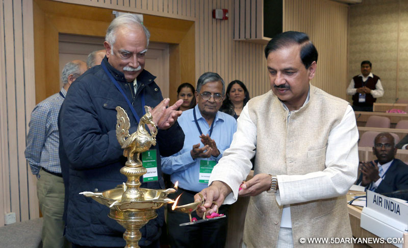Ashok Gajapathi Raju Pusapati and, Dr. Mahesh Sharma lighting the traditional lamp to inaugurate the workshop on National Aviation University, in New Delhi on March 04, 2015. 