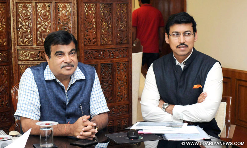 Nitin Gadkari meeting the Minister of State for Information & Broadcasting, Col. Rajyavardhan Singh Rathore, in New Delhi on March 25, 2015.