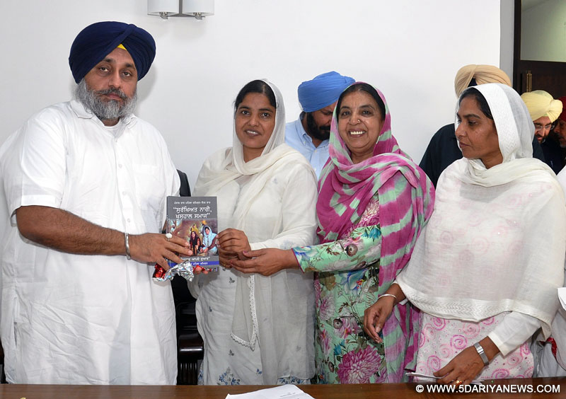 Sukhbir Singh Badal accompanied by Bibi Paramjit Kaur Landran releasing the brochure published by Punjab State Women Commission at Chandigarh on Thursday. 