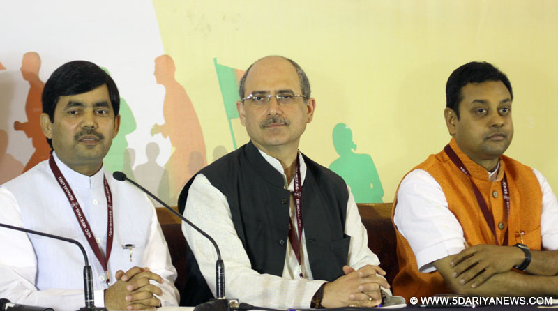 Bengaluru: BJP spokespersons Syed Shahnawaz Hussain and Nalin Kohli address a conference BJP National Executive meeting in Bengaluru, on April 2, 2015.