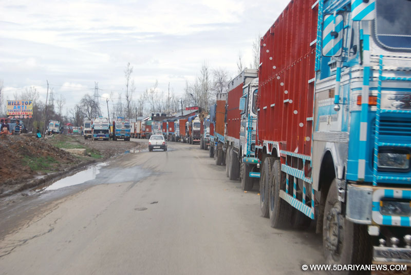 Anantnag: Trucks remain stranded on Jammu-Srinagar national highway which remained closed for the fourth consecutive day following landslides triggered by heavy rain in Anantnag