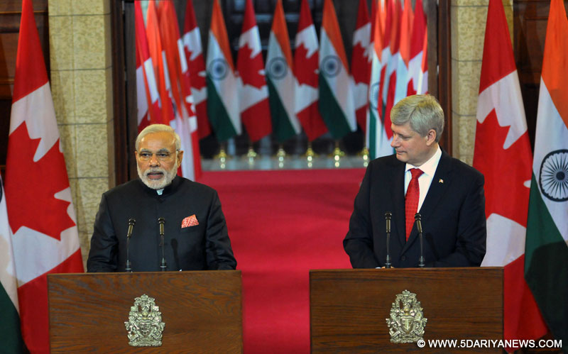 The Prime Minister, Narendra Modi giving his statement to the media, during the Joint Press Interaction, at Parliament Hill, in Ottawa, Canada on April 15, 2015. Prime Minister of Canada, the Right Honourable Stephen Harper is also seen.