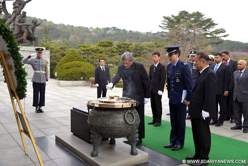 The Union Minister for Defence, Manohar Parrikar paying homage at the National Cemetery, at Daejeon, in South Korea on April 16, 2015.