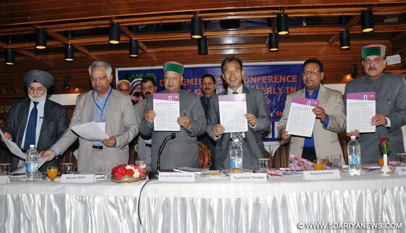 Chief Minister Virbhadra Singh releasing a book on 