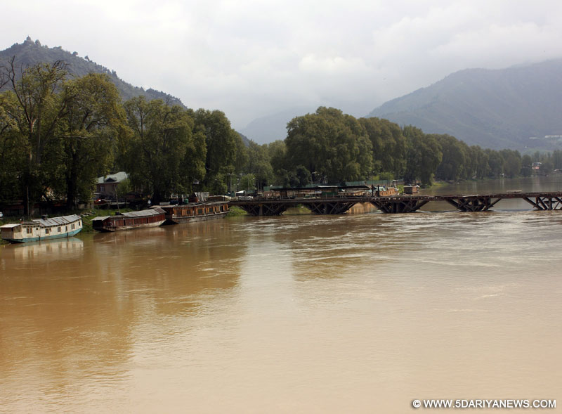 Srinagar: A view of swollen Jhelum river in Srinagar on April 21, 2015. The Jammu and Kashmir government has sounded flood alert in the city after incessant rains.