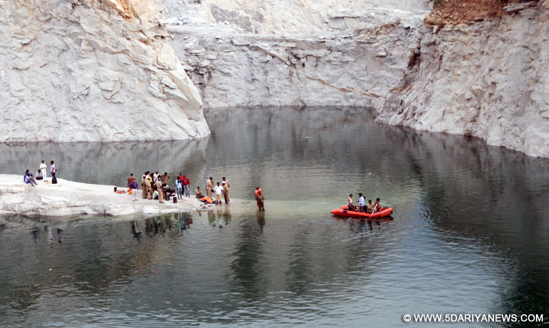 Bengaluru: Search operations underway to trace the bodies of the five students, who drowned in a stone quarry pit, in Bettahalasur of Chikkajala, near Yelahanka Air force Station, in Bengaluru on April 23, 2015. 