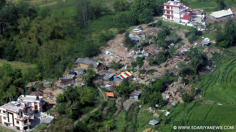 An aerial view of damaged houses occurred due to a recent massive earthquake in Nepal, taken by the Indian Air Force (IAF) helicopter on its way to Dhadhing.