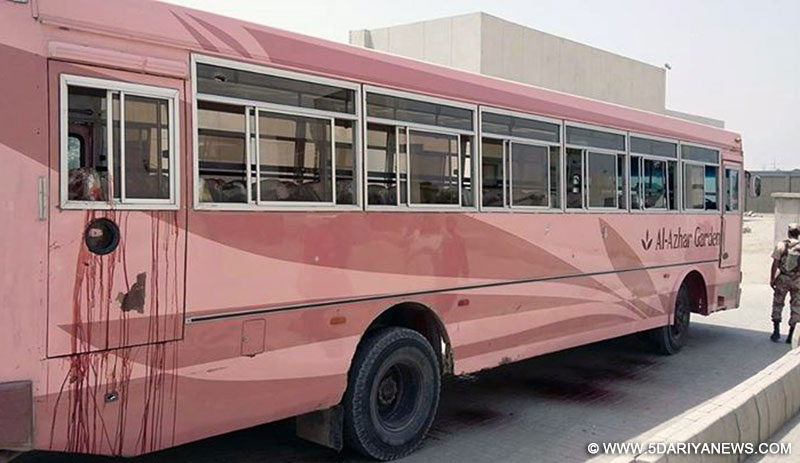 A bus attacked by unknown militants is seen in southern Pakistani port city of Karachi, May 13, 2015. At least 43 people were killed and 13 others were injured when unknown gunmen opened fire at a passenger bus carrying about 60 to 65 people of a minority group in Pakistan