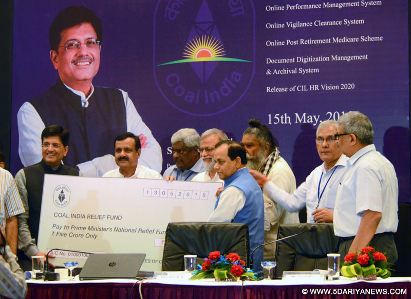 Piyush Goyal being presented a cheque of Rs.5 crore by the Coal India Employees, for the Prime Minister’s National Relief Fund, in Kolkata on May 15, 2015. 