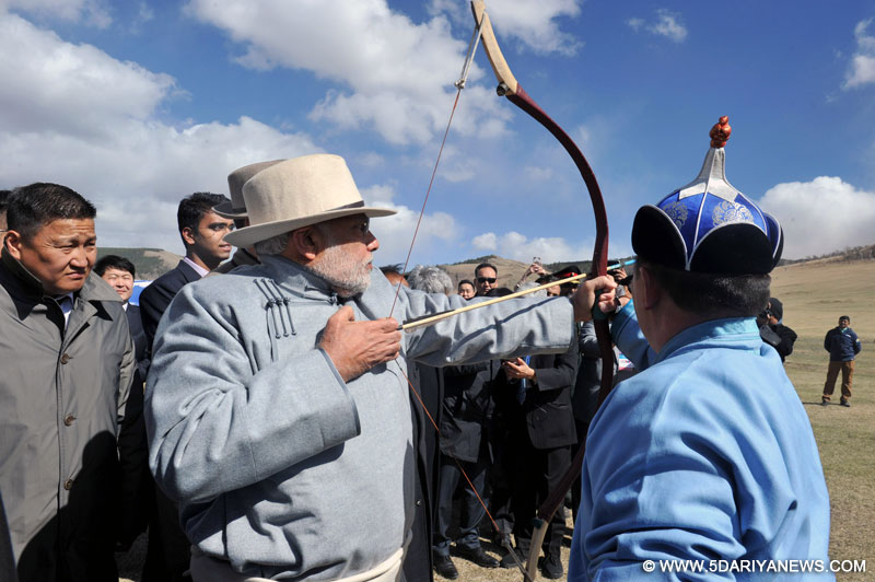 The Prime Minister, Shri Narendra Modi trying his hand on archery at Mini Naadam Festival, in Ulaanbaatar, Mongolia on May 17, 2015.