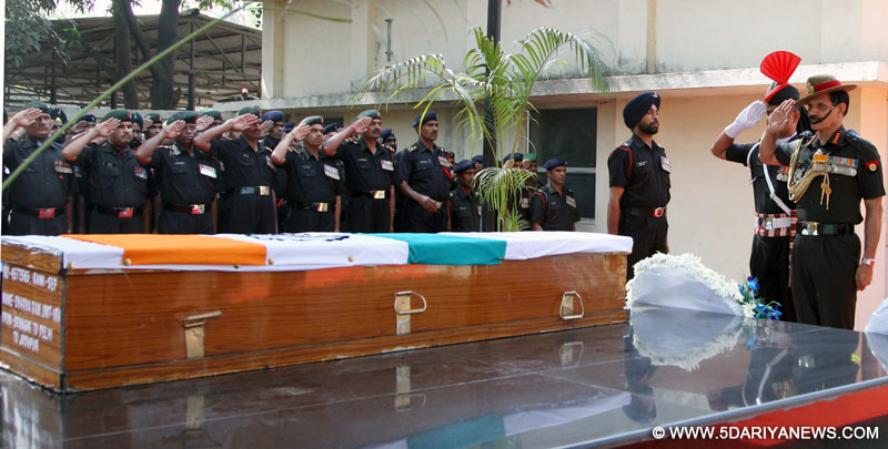 The Chief of Army Staff, General Dalbir Singh paying homage to mortal remains of Sep Dharma Ram of 1 Rashtriya Rifles (martyred battling terrorists in Kashmir on 25 May 2015), at Base Hospital, in New Delhi on May 27, 2015.