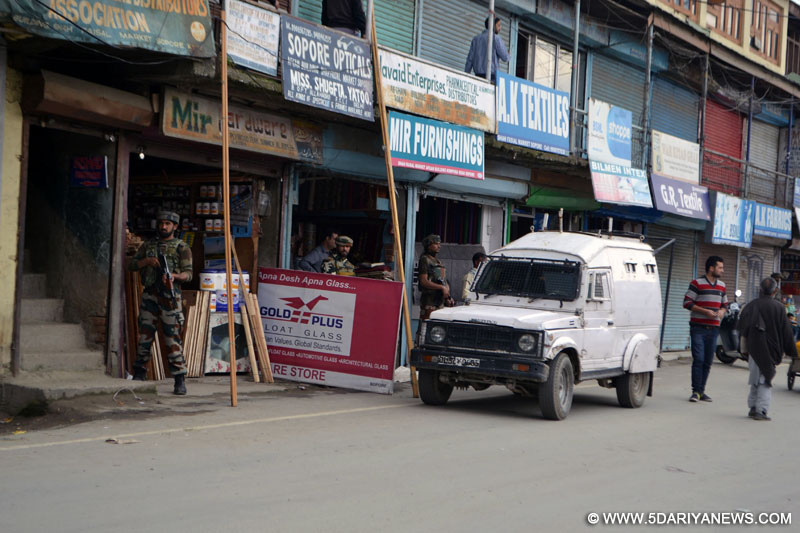 Sopore: Security personnel deployed at a BSNL telecom company outlet as militants attack in Sopore of Baramulla district, Jammu and Kashmir, on May 25, 2015. One person was killed and two others were injured.