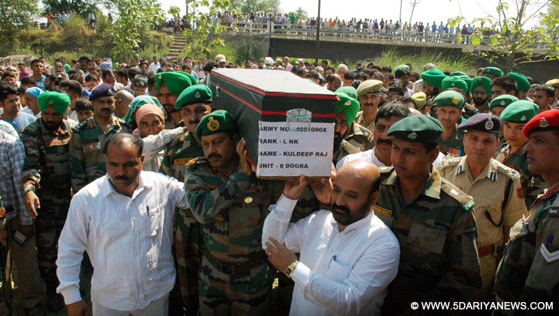 Soldiers pay tribute to LNK Kuldeep Raj who was killed in Manipur ambush, at Jammu on June 7, 2015. 