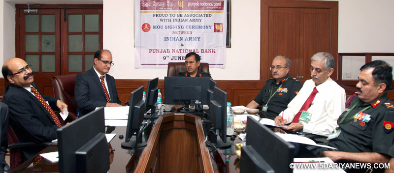 The Adjutant General, Lt. Gen. Rakesh Sharma witnessing the signing of a Memorandum of Understanding (MoU) between the Indian Army and Punjab National Bank (PNB) on the Defence Salary Package, in New Delhi on June 09, 2015.