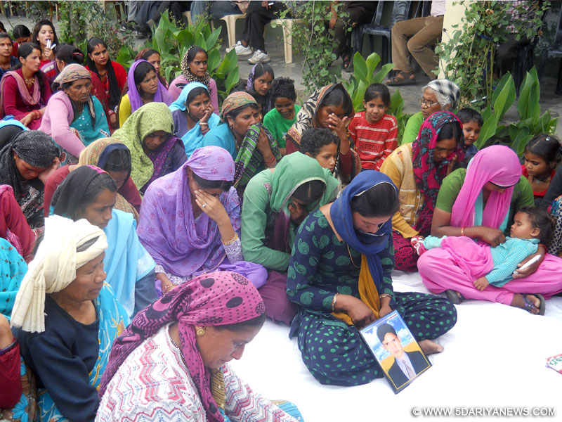 Widows mourning for husbands killed in the Uttrakhand floods in 2013