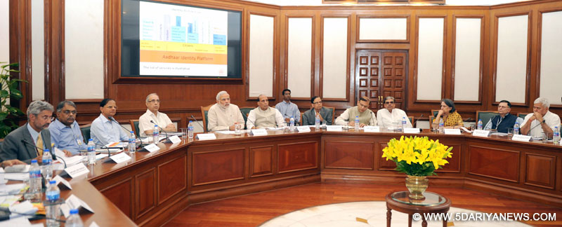 The Prime Minister, Narendra Modi chairing a high-level meeting to review the progress of UID and DBT, in New Delhi on June 18, 2015. 