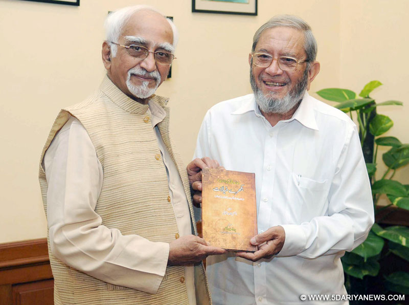 The Vice President, Mohd. Hamid Ansari being presented a book entitled “Bikhare Khyalat”, by Prof. Abdul Haq, in New Delhi on June 18, 2015. 