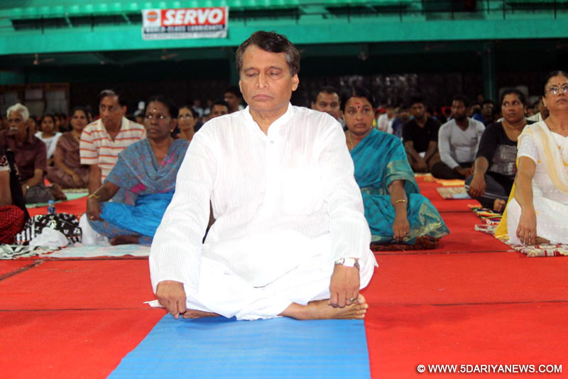 The Union Minister for Railways, Suresh Prabhakar Prabhu participates in the mass yoga demonstration, on the occasion of International Yoga Day Celebrations, in Kochi, Kerala on June 21, 2015.