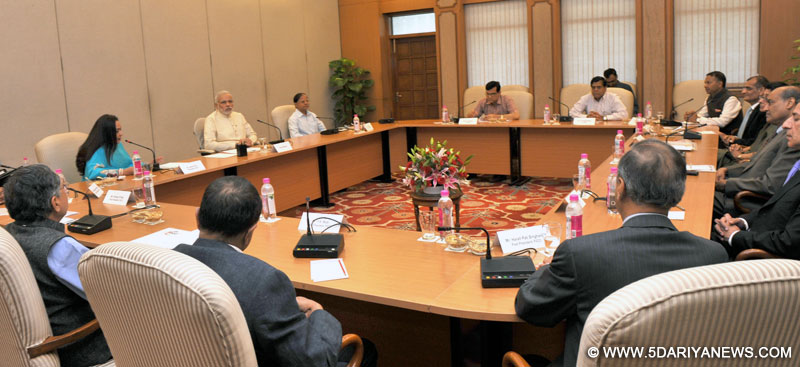 A delegation from the Federation of Indian Chambers of Commerce and Industry (FICCI) calling on the Prime Minister, Narendra Modi, in New Delhi on June 30, 2015.