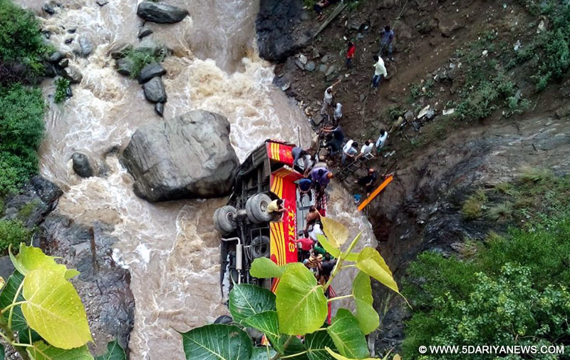 private bus that fell into Machhada Khud near Rampur, in Shimla district of Himachal Pradesh on July 10, 2015. Atleast six people were killed and 23 injured in the accident