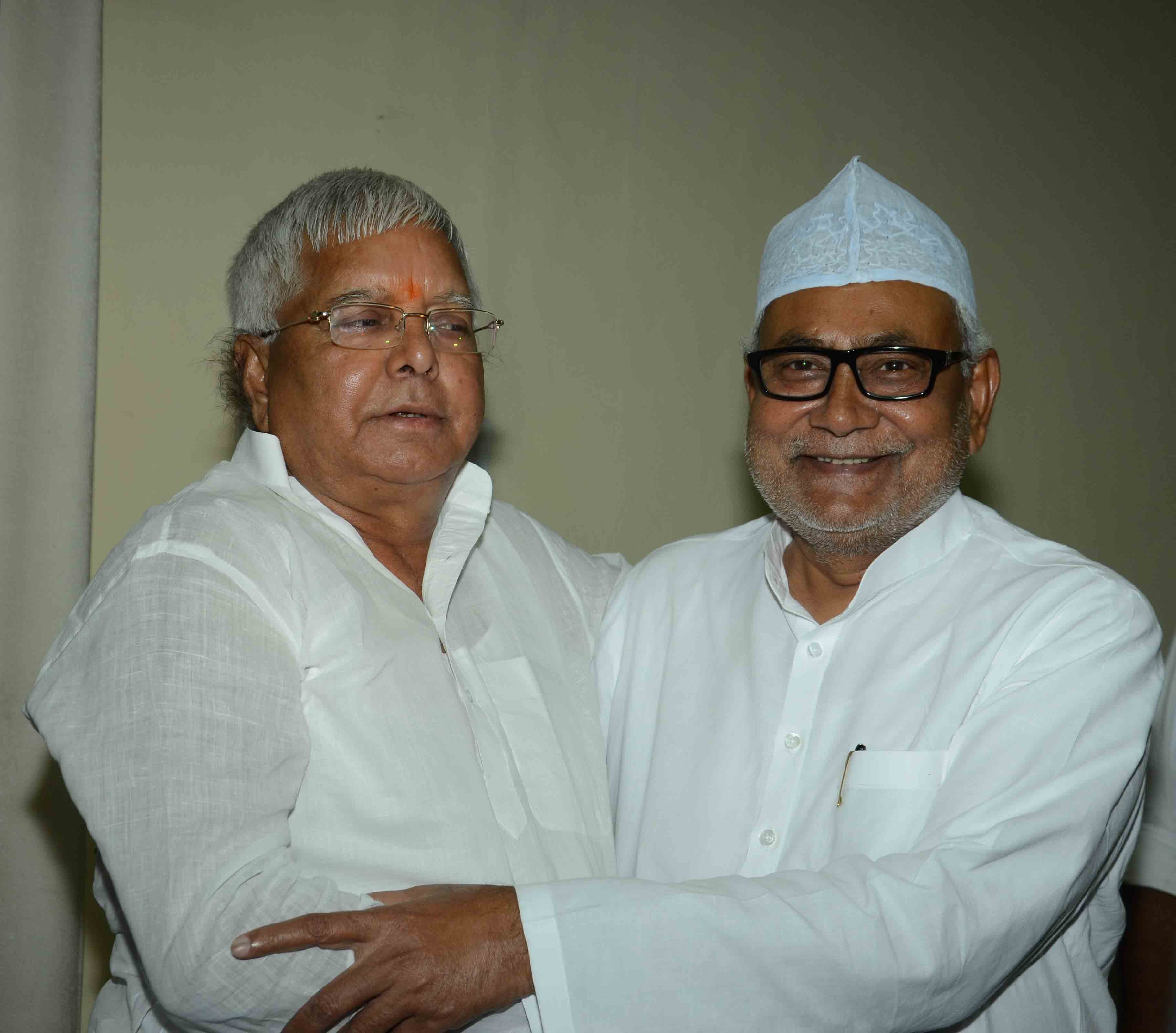 Bihar Chief minister Nitish Kumar and RJD chief Lalu Prasad Yadav during an iftar party organised at CM House in Patna on July 11, 2015. 
