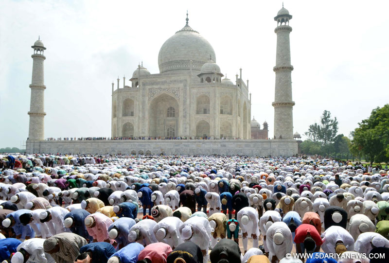 Agra: Muslims offer namaz at the Taj Mahal on the occasion of Eid-ul-Fitr on July 18, 2015. 