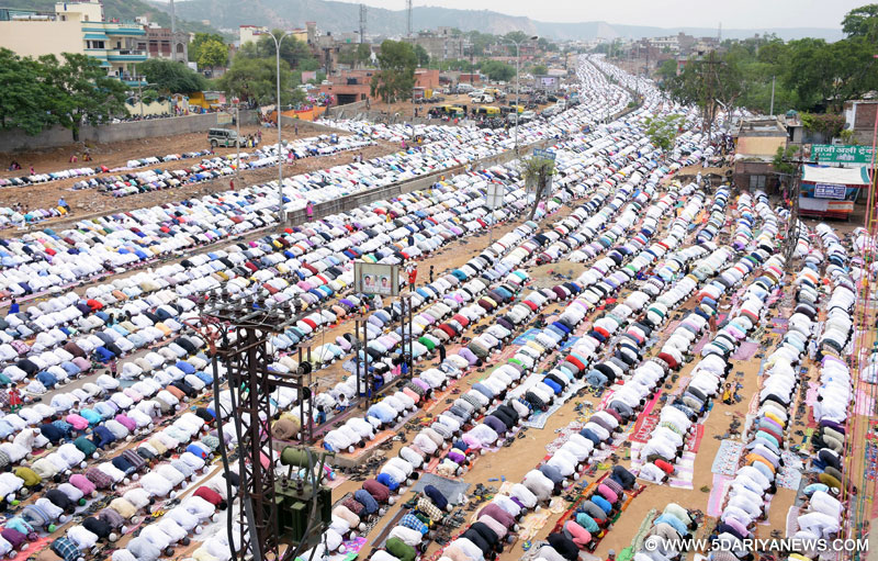 Muslims offer prayers on the occasion of Eid-ul-Fitr on the outskirts of Jaipur on July 18, 2015. 