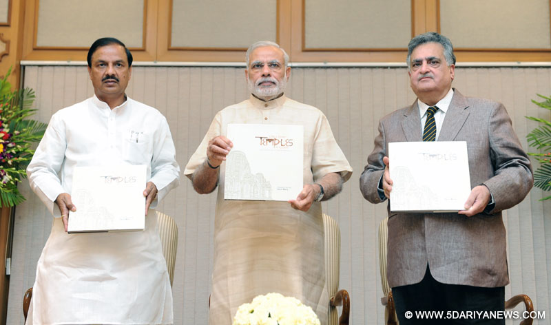 The Prime Minister, Shri Narendra Modi releasing a book "Early Hindu Temples of Gujarat", by Shri Varun Maira, in New Delhi on July 20, 2015. The Minister of State for Culture (Independent Charge), Tourism (Independent Charge) and Civil Aviation, Dr. Mahesh Sharma is also seen.