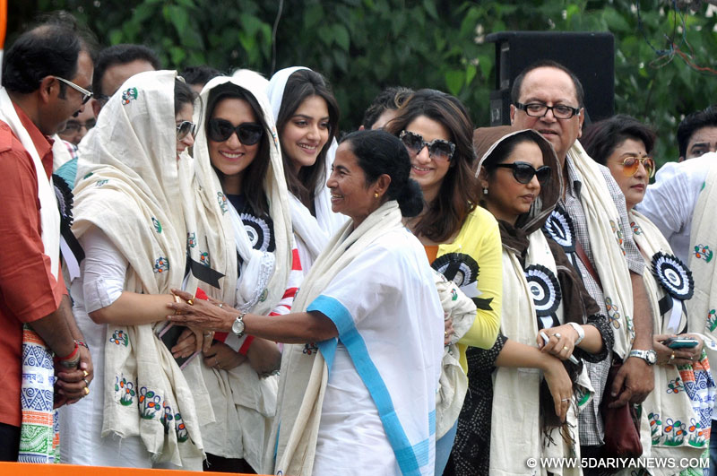 Kolkata: West Bengal Chief Minister and Trinamool Congress supremo Mamata Banerjee with actresses Srabanti Chatterjee, Mimi Chakraborty, Nusrat Jahan, and Tanusree Chakraborty during a programme organised on Martyrs