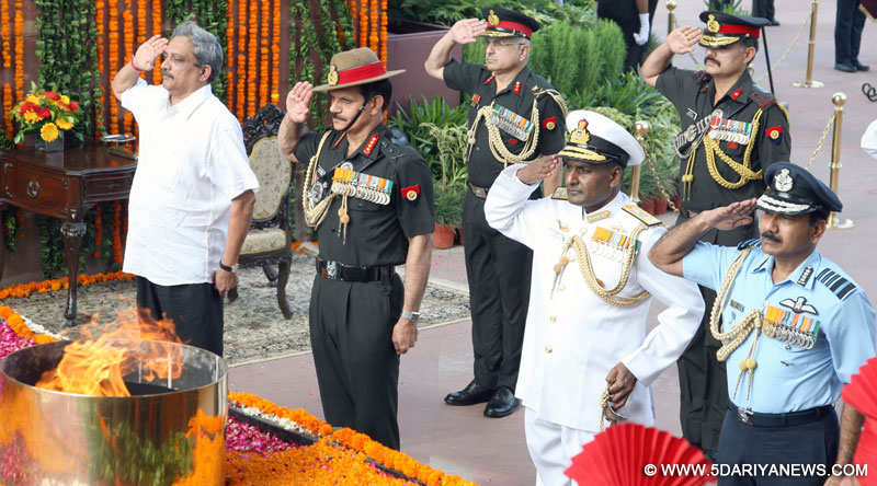 The Union Minister for Defence, Manohar Parrikar accompanied by the Chief of Army Staff, General Dalbir Singh and the Chief of the Air Staff, Air Chief Marshal Arup Raha paying homage to martyrs, at Amar Jawan Jyoti, India Gate, in New Delhi, on July 26, 2015.