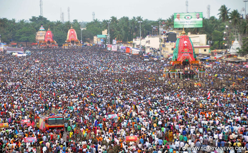 Puri: Devotees in large numbers participate in Bahuda Yaatra in Puri on July 26, 2015.