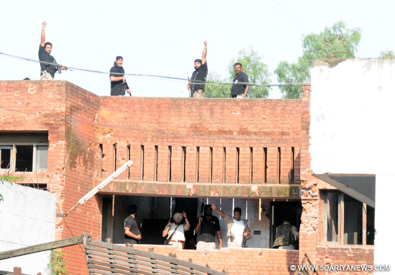 Policemen celebrate after killing the terrorists who attacked Dinanagar police station on July 27, 2015. 