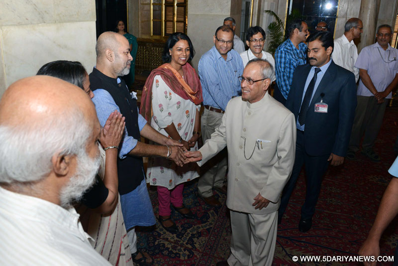 New Delhi: President Pranab Mukherjee meets media personnel at Rashtrapati Bhavan in New Delhi, on Aug 3, 2015.
