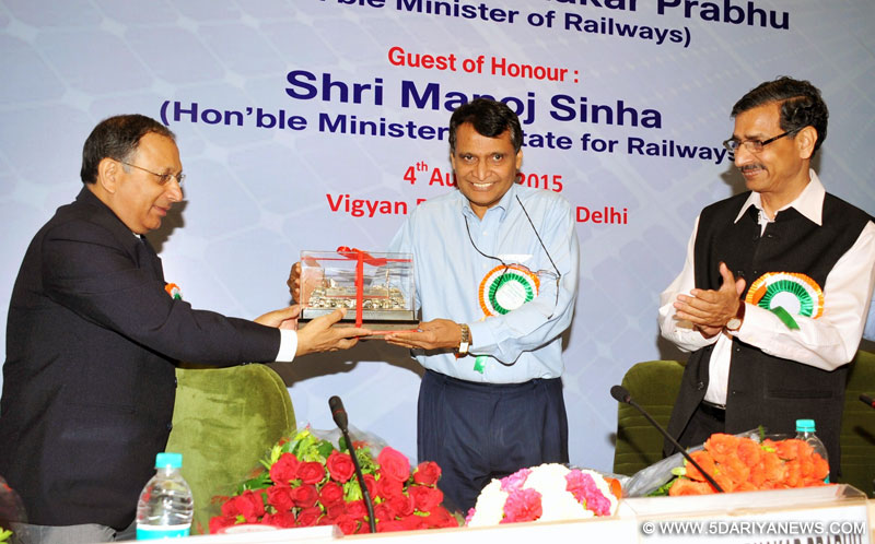 The Union Minister for Railways, Shri Suresh Prabhakar Prabhu being presented a memento by the Member Electrical, Railway Board and Patron IREE, Shri Navin Tandon, at the inauguration of a Seminar on Solar Energy-opportunities in Rail Sector, organised by the Institution of Railway Electrical Engineers, the Delhi Metro Rail Corporation and the Institute of Engineering and Technology, in New Delhi on August 04, 2015. The Chairman, Railway Board, Shri A.K. Mital is also seen.