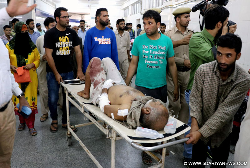 Srinagar: A man injured in a grenade explosion in a Shopian mosque compound being taken for treatment at SMHS Hospital in Srinagar on Aug 13, 2015. At least 11 people were injured in the explosion.