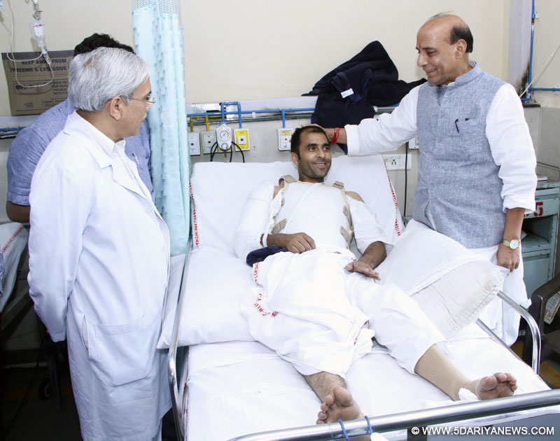 The Union Home Minister, Shri Rajnath Singh interacting with the Constable of Jammu and Kashmir Police, Shri Mohd. Salim who is injured during an encounter with terrorists, at AIIMS, in New Delhi on August 29, 2015.