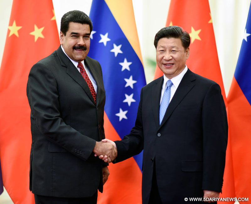 Chinese President Xi Jinping (R) meets with Venezuelan President Nicolas Maduro in Beijing, capital of China, Sept. 1, 2015.