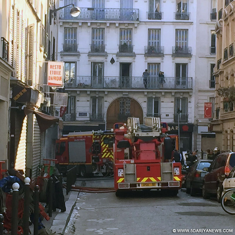 Fire trucks are seen near the site of a fire in Paris, capital of France, on Sept. 2, 2015. A fire in an apartment building in the northern suburbs of Paris early Wednesday has left eight people dead, including two children, local media reported. 